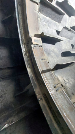 During a maintenance inspection, metal components are discovered inside the dryer drum, indicating potential mechanical issues that require attention.の写真素材