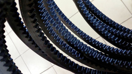 Close-up view of several toothed V belts showing their design and texture, ideal for powering various types of machinery effectively and reliably.の写真素材