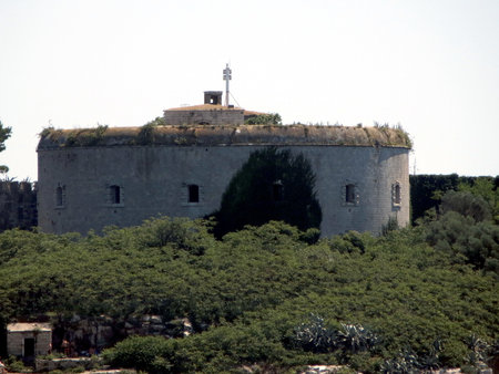 Fort Mamula stands on Lastavitsa Island in Montenegros Adriatic Sea. This historic fortress offers breathtaking views of the surrounding landscape and rich cultural significance.の写真素材