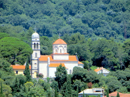 Savina Monastery near Herceg Novi stands beautifully among green hills, showing its unique architecture and vibrant red rooftops against the natural backdrop.の写真素材