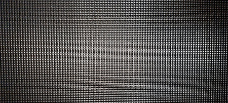 Cut glass texture features a mesmerizing array of geometric patterns, creating a visually stunning effect in a contemporary setting, reflecting light beautifully.の写真素材