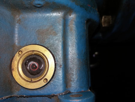 Close-up of a compression head housing showing its design features, highlighting wear and tear on...