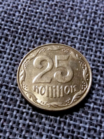 This 25 kopecks coin features intricate details on its reverse side, highlighting the currency of Ukraine. Its classic design reflects the cultural heritage of the nation.の写真素材