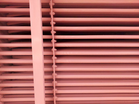 The economizer tube grid displays a series of parallel tubes arranged in a structured grid. This component is crucial for energy efficiency in industrial systems.の写真素材