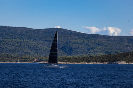 Luxury sailing yacht with black sails in Croatia