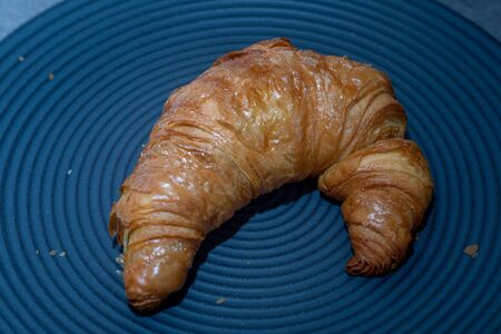 fresh golden croissant on dark backgroundの写真素材
