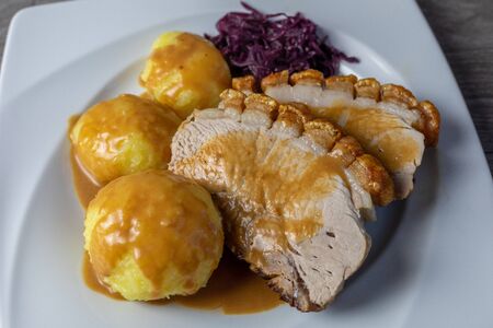 Fine Meat - Pork Roast with Crackle,  potato Dumpling and red cabbageの写真素材