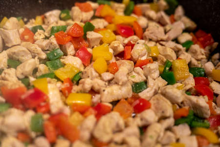 Big pot with meat and vegetables (chicken, pepper)の写真素材
