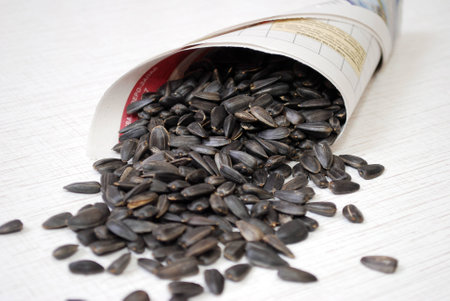 Fried seeds of a sunflower in a paper bagの写真素材