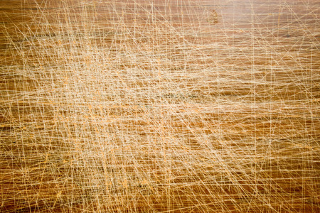 hard scratched top of an old wooden table の写真素材