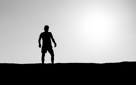 Athletic Silhouette with bright sun lightの写真素材