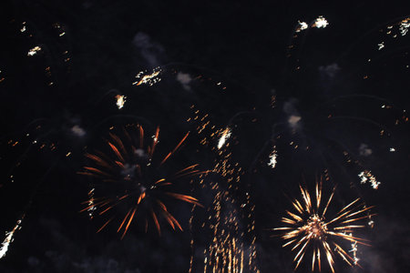 Fire show. Night background. Fireworks. Firework. Holidays of Christmas and New Year in bright...