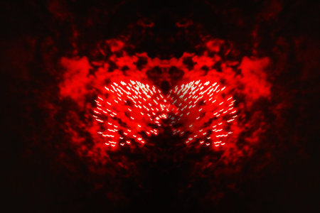 An eagle flash of bright red, blue and yellow firework lights. Halloween, Christmas, Independence Day, New Year.の写真素材