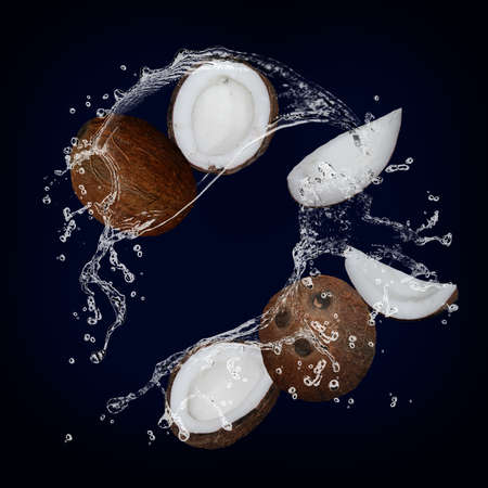Juicy delicious coconut with splashes of juice and milk gorgeous dessertの写真素材