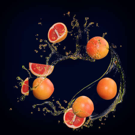 Juicy delicious grapefruit with splashes of juice great dessertの写真素材