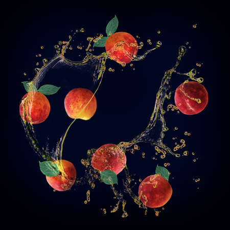 Juicy tasty peach with splashes of juiceの写真素材
