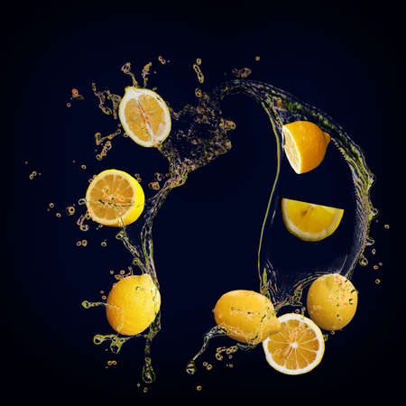Juicy tasty lemon with splashes of juice is full of vitaminsの写真素材