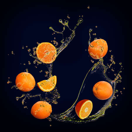 Juicy tasty orange with splashes of juice is very healthyの写真素材
