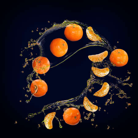 Juicy tasty tangerine with splashes of juice is very healthyの写真素材
