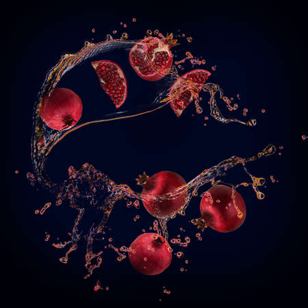 Juicy tasty pomegranate with juice bursts is very good for healthの写真素材