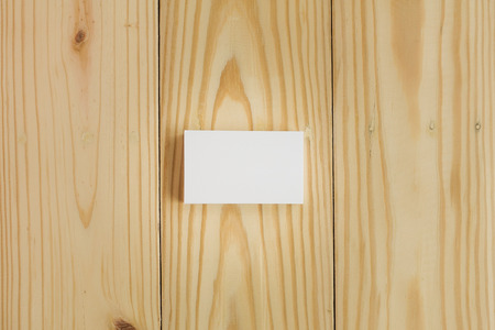 Blank business cards on wooden backgroundの写真素材
