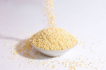 Falling millet into a cupの写真素材