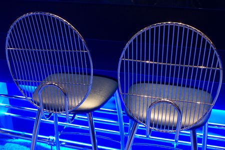 chrome seats with blue neon glowの写真素材