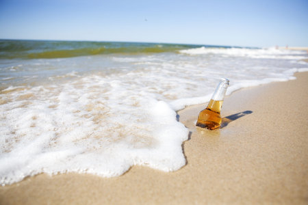 Bottle of Beer on a Beachの写真素材