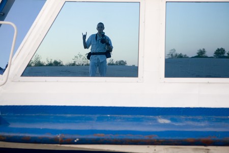 Reflexion of the photographer in the window of the ship の写真素材