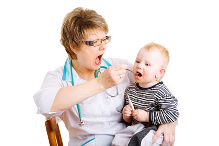 doctor gives remedy to childの写真素材
