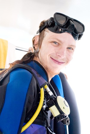 a wet smiling diver just has got out of waterの写真素材