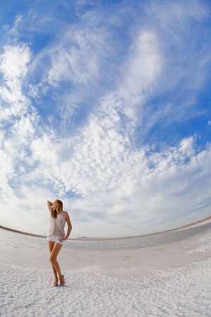 girl in a salt lake in a sunriseの写真素材
