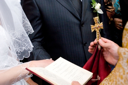 blessing the couple by the crossの写真素材
