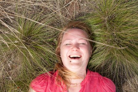 girl and ladybirds on the grassの写真素材