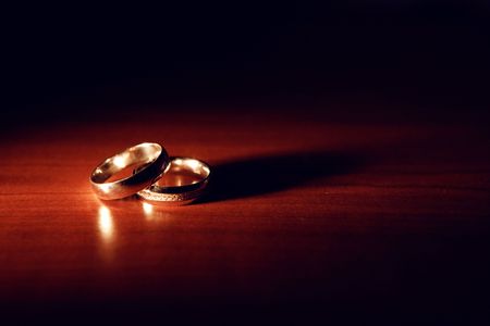 wedding rings on the tableの写真素材