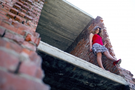 girl on the abandoned buildingの写真素材