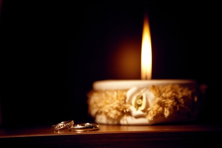 candle and  wedding ringsの写真素材