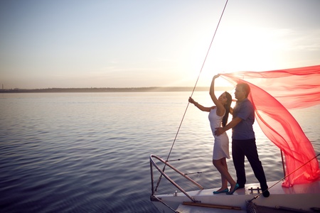 man and girl under the sailの写真素材