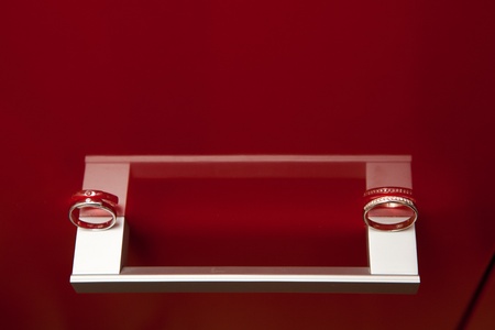 wedding rings on the red backgroundの写真素材
