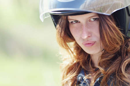 portrait of a young girl in motorcycle helmetの写真素材