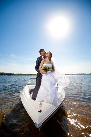 happy young couple on the yachtの写真素材