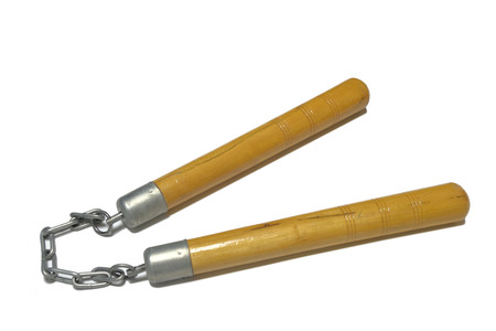 Wooden nunchaku on a chain isolated on white backgroundの写真素材