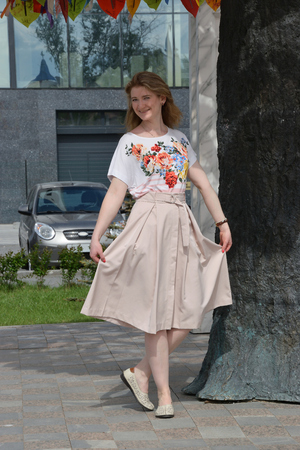 Beautiful smiling girl standing in the park.の写真素材