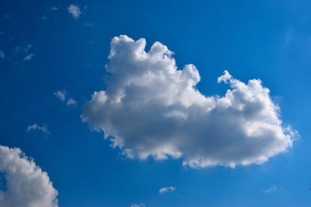 White cloud, lit by the sun.の写真素材