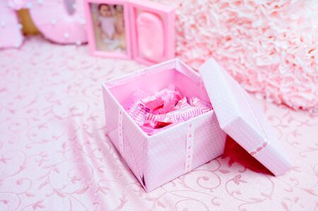 Pink macaroons on a pink background. Sweet background. Flat lay, top view, copy spaceの写真素材