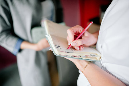 Senior woman writing in notebook