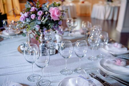 beautiful wedding table, wedding table setting, glasses, flowersの写真素材