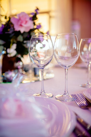 Beautiful festive table setting with elegant white flowers and cutlery, dinner table decoration