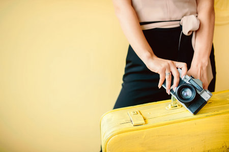 Hello Summer. Summer holidays, vacation and travel concept. Suitcase or luggage bag on yellow...