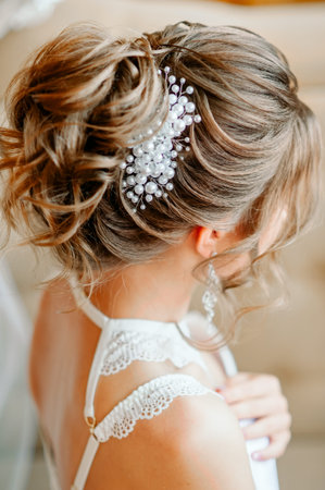 Evening hairstyle with a beautiful hairpin, rear view
